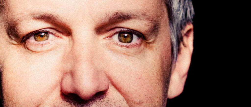 A close-up portrait of a man's face Discount Refractive Lens Exchange—Really?
